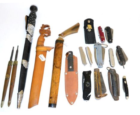 Eleven Various Folding Pocket Knives, some with marlin spikes; six Other Edged Weapons, including a Malayan parang with wood 