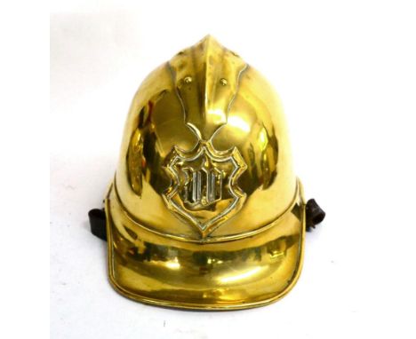 An Early 20th Century German Fireman's Brass Adrian Style Helmet by J G Lieb, Biberach, Riss, with shaped shallow comb, embos