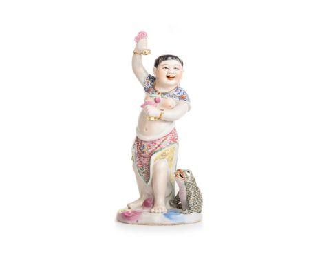 CHINESE PORCELAIN IMMORTAL FIGURE, REPUBLIC PERIOD (1911 - 1949) modelled as Liu Hai, wearing a yellow and pink enamel robe, 