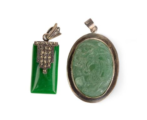 TWO CHINESE JADE PENDANTS, REPUBLIC PERIOD (1911-1949) comprising an oval shaped example, carved with a dragon, within a whit