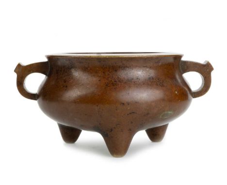 CHINESE BRONZE CENSER, 19TH CENTURY  of circular form with archaistic 'ear' handles, raised on tripod feet, bearing Xuande ma