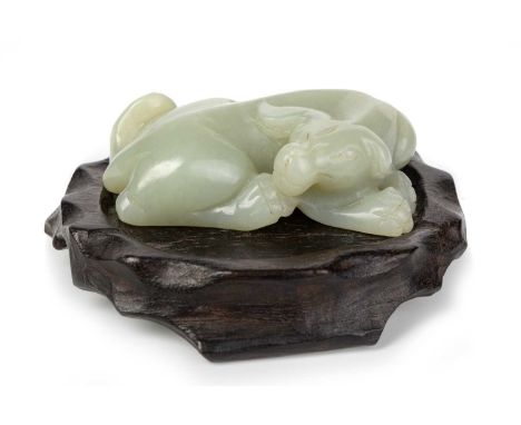 CHINESE JADE FIGURE, EARLY / MID 20TH CENTURY modelled as a bull, posed lying down, on wooden standjade figure 6cm long Good 