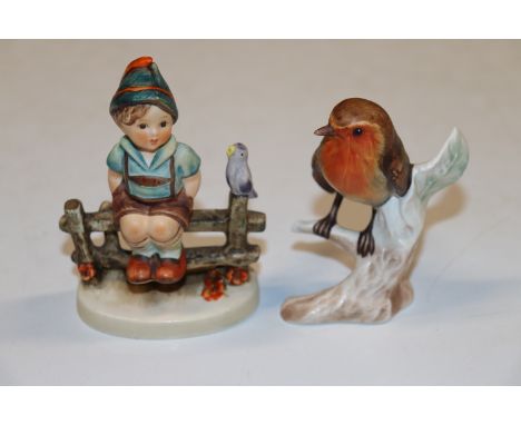A Goebel figure and a Goebel model of a robin 