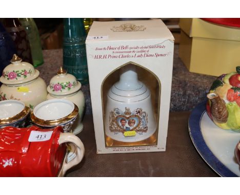 A Prince Charles and Lady Diana Bells Scotch whisky decanter and contents in original box 