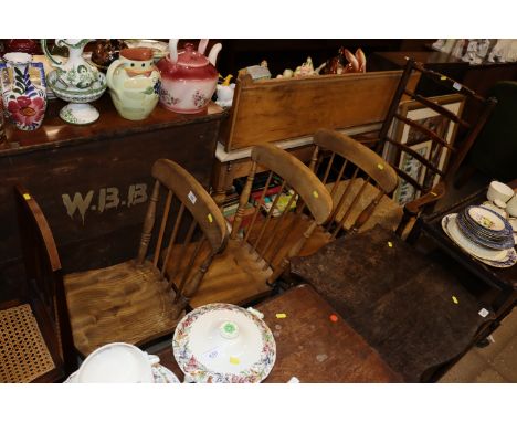 Three stick back and elm seated chairs and a rush seated ladder back chair 