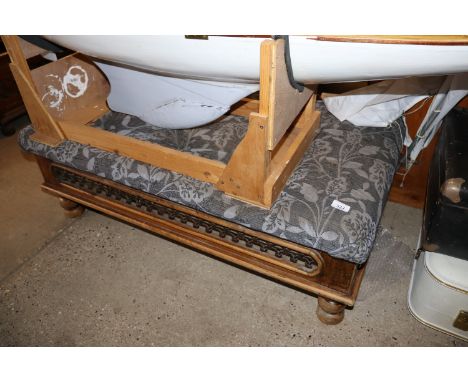 A hardwood and upholstered stool
