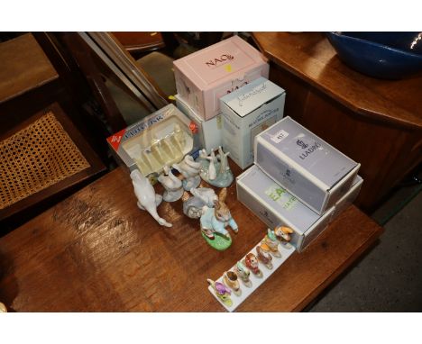 A quantity of Lladro and Nao figures; a Beswick Peter Rabbit with original box; a Disney Snow White and The Seven Dwarfs toas