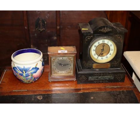A Mappin & Webb single hole slate mantel clock; and an Elliott mantel clock retailed by Garrod & Co.