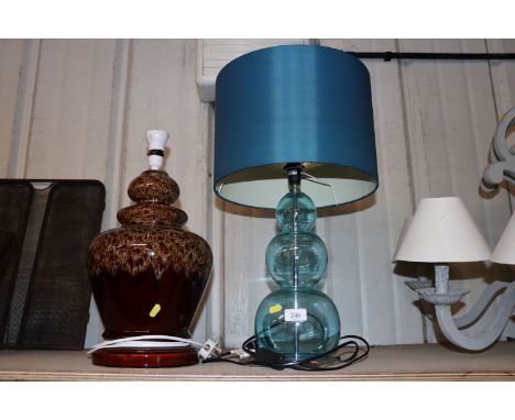 A glass table lamp and a running glazed table lamp 