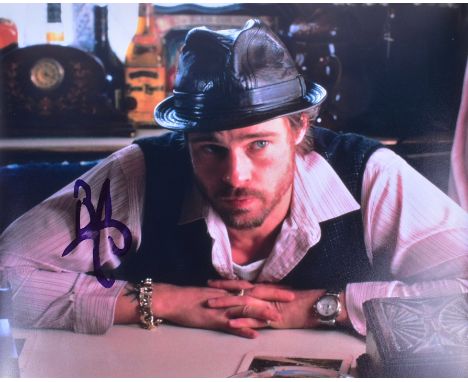 Brad Pitt - Snatch (2000) - autographed 8x10" promotional photograph from the movie. Signed in black ink to a light area of t