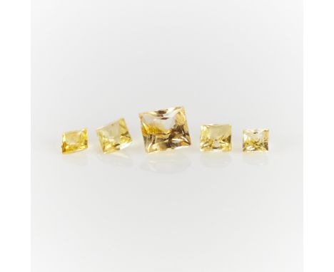 A group of five yellow sapphires. Four smaller square cut yellow sapphires, 0.35 ctw. One larger square cut yellow sapphire, 