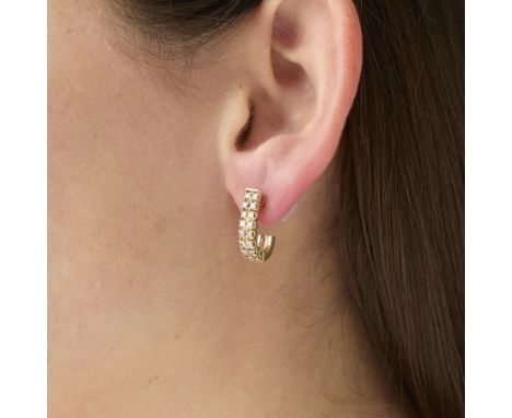 Pair of 14k yellow gold diamond J hoops. Each earring is set with two rows of 8 (16 total) round full cut diamonds. Approxima