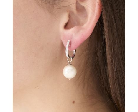 Pair of 18k white gold, pearl, and diamond hoop earrings with hooplets. Each earring is set with a full drilled cultured pear