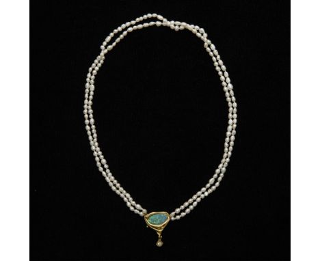 14k yellow gold, seed pearl, and synthetic opal necklace. Comprised of two strands of baroque seed pearls with a central 14k 