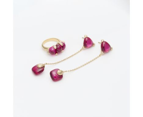 Synthetic ruby demi-parure comprised of a ring and dangle earrings.One 18k yellow gold ring set with three cabochon synthetic