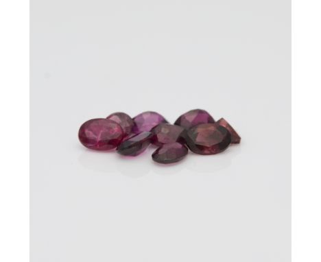 Group of nine garnet. Six oval cuts, 3.30 ctw, one round cut 0.35 ct, one pear cut 0.65 ct, one trillion cut 0.45 ct.(Smalles