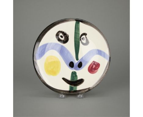 Pablo Picasso (Spanish, 1881-1973). White earthenware studio ceramic terre de faience plate with colored engobe and glaze tit