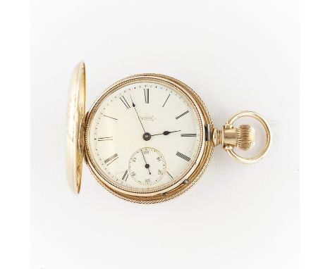 Elgin National Watch Company, United States. 14k yellow gold pocket watch in hunter case with engraved foliate and floral det