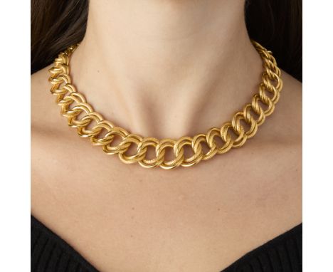 22k Greek gold double curb link necklace. One link textured, one smooth. With pin closure, marked at the tip with a 22 and in