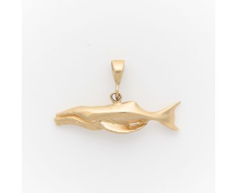 14k yellow gold pendant in the form of a whale. Marked 14k GXO along the reverse. Chain for photography purposes only, not in