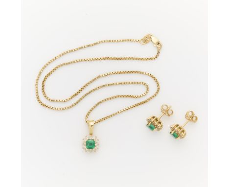 18k yellow gold emerald and diamond earrings and necklace.The necklace on a 14k yellow gold box chain with lobster clasp clos