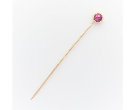 14k yellow gold stick pin surmounted with a bezel set round cut pink tourmaline. Unmarked, tested 14k.Length: 57.02 mm. Gross