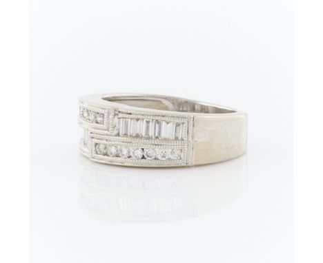 14k white gold and mixed cut diamond band. The diamonds are channel set and include14 round full cuts approximately, 0.20 ctw