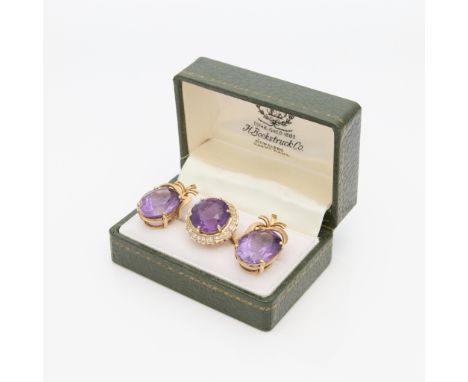 Group of yellow gold and amethyst jewelry including one 14k yellow gold ring set with central round cut amethyst of approxima
