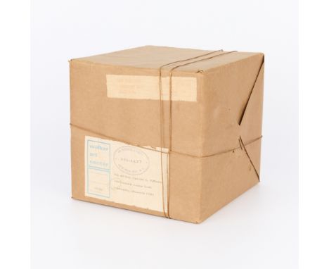 Christo (Bulgarian-American, 1935-2020). Conceptual art sculpture of a cardboard box wrapped in brown paper and twine, titled