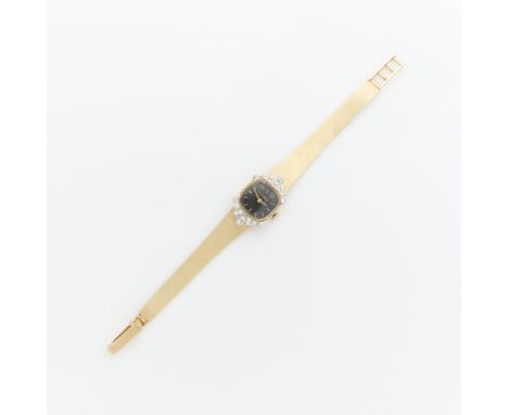 Lucien Piccard 14k yellow gold and diamond ladies cocktail watch. On a finely articulated gold bracelet with a brushed satin 