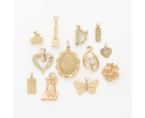 Group of 12 14k yellow gold pendants and charms (one is 10k). Including a 14k yellow gold Credit Zurich one gram gold pendant