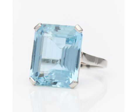 18k white gold cocktail ring set with step cut aquamarine. Aquamarine approximately 11.37 carats. Unmarked, tested 18k.Ring s