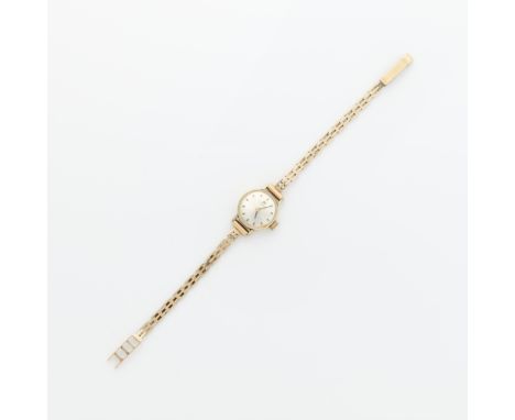 Tissot 14k yellow gold ladies watch. On a 14k yellow gold ladder link bracelet with fold over clasp. Marked 585HU at the clas
