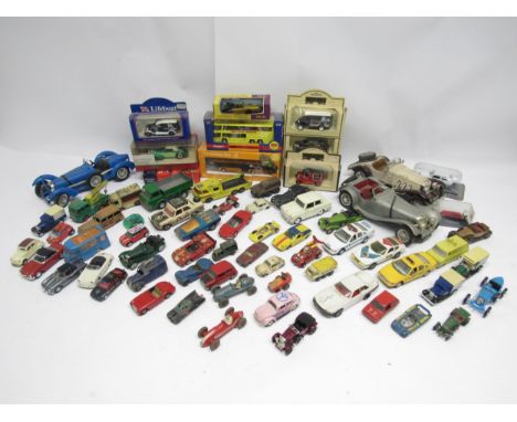 A mixed collection of boxed, loose and playworn diecast model vehicles including Corgi, Dinky, Matchbox, Burago 1:18 scale et