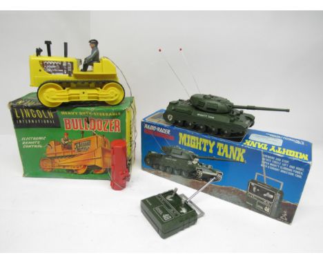 A boxed Taiyo Radio-Racer radio controlled Mighty Tank and a Lincoln International remote control bulldozer (missing blade) (