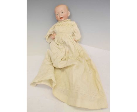 Early 20th century Kammer &amp; Reinhardt bisque head doll, with painted blue eyes and open mouth detail, stamped next number
