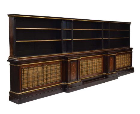 Late 19th century rosewood, ebonised and inlaid marquetry breakfront bookcase, circa 1880, the ebonised and parcel gilt upper