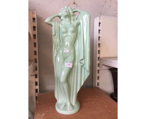 A GREEN ART DECO CERAMIC LADY FIGURE    C