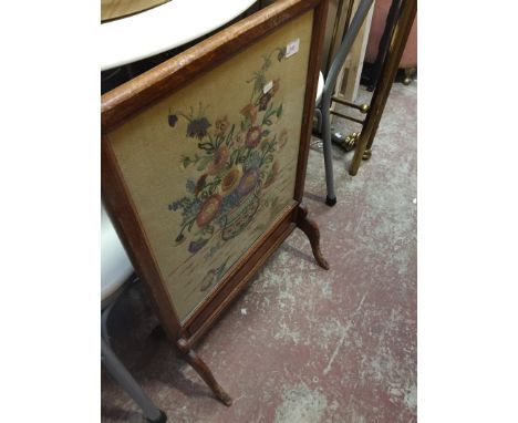 AN EMBROIDERED FIRESCREEN