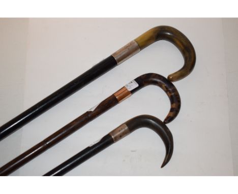 A silver mounted walking stick, with a horn handle, and two others similar (3)