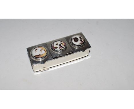 A silver triple pill box, decorated enamel dog plaques, 6 cm wide