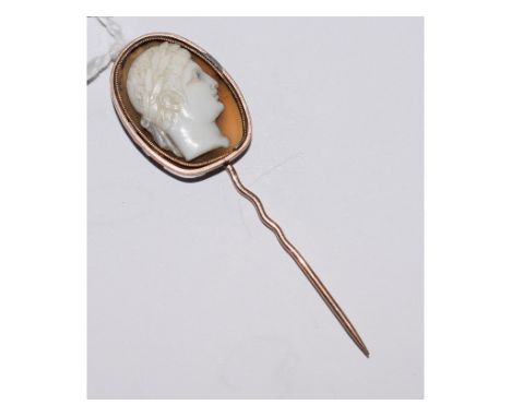 A carved cameo stick pin   Condition report  Report by NGThis is a hard stone cameo.Report by NGMount is unmarked, misshapen 