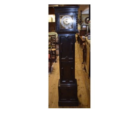 A dwarf longcase clock, the 19 cm square brass dial with Roman numerals, in an oak case, the trunk door with a geometric moul