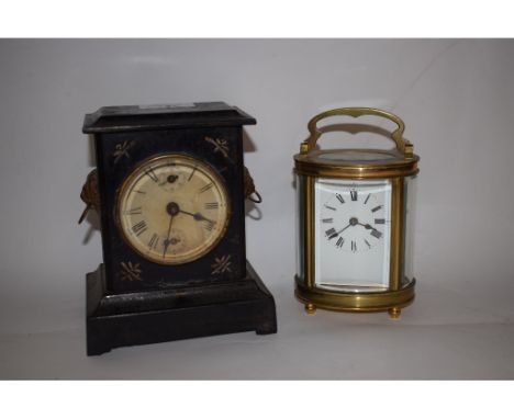 A French carriage clock, in a oval brass case and a Victorian mantel clock (2)