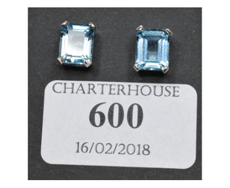 A pair of silver and emerald cut blue topaz stud earrings   Condition report  Report by NGModern earrings with no visible pro