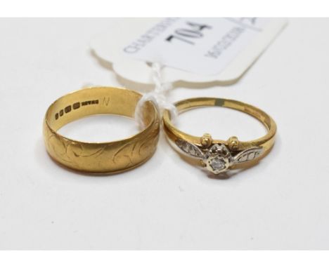 An 18ct gold wedding band, engraved decoration, approx. ring size N, approx. 3.4 g, and an 18ct gold, platinum and diamond ri