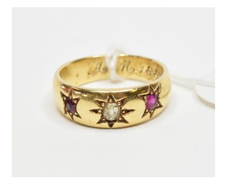 A diamond and ruby gypsy ring, in a yellow coloured metal setting, inscribed and dated 1880, approx. ring size M   Condition 