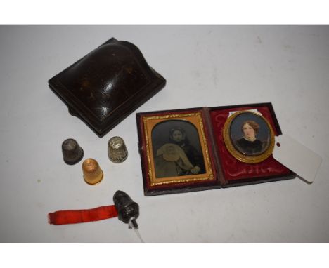 An oval portrait miniature, of a lady, in a brooch mount, an Ambrotype, cased, a Victorian silver miniature tape measure (6)