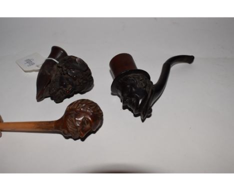 A pipe, the bowl carved in the form of a man, and two others similar (3)