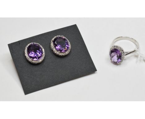 A silver and amethyst ring, approx. ring size M½, and a pair of similar earrings (2) Condition report Modern